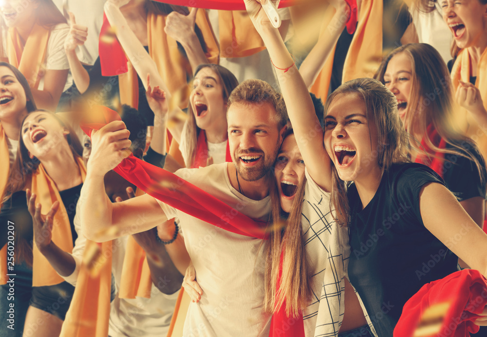 Group of happy fans are cheering for their team victory. Group of happy fans are cheering for their team victory.