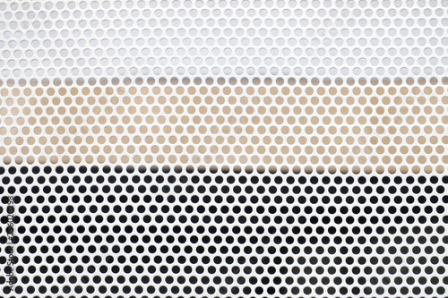 Close up many small dotted pattern of a sunburn protection steel sheet for background texture 