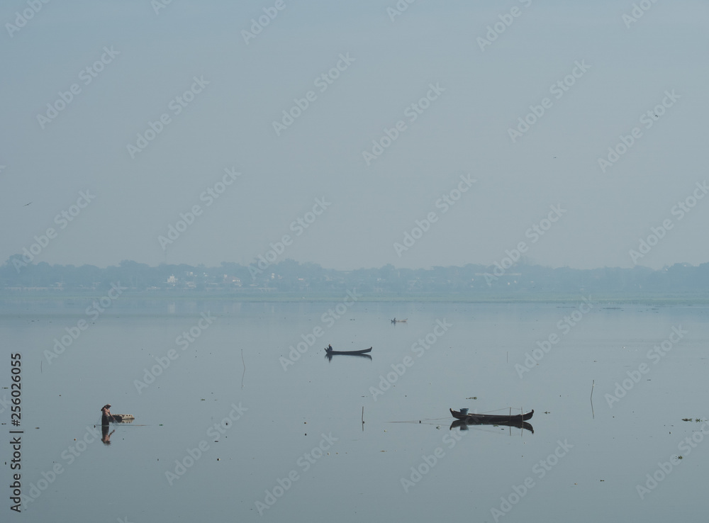 Early morning at Amarapura, Myanmar, fisherman fishing at the lake.