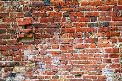 old repaired wall with brick texture