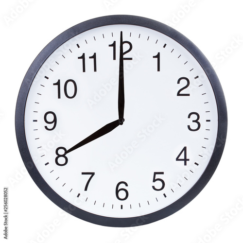 Round office clock showing eight o'clock isolated on white background