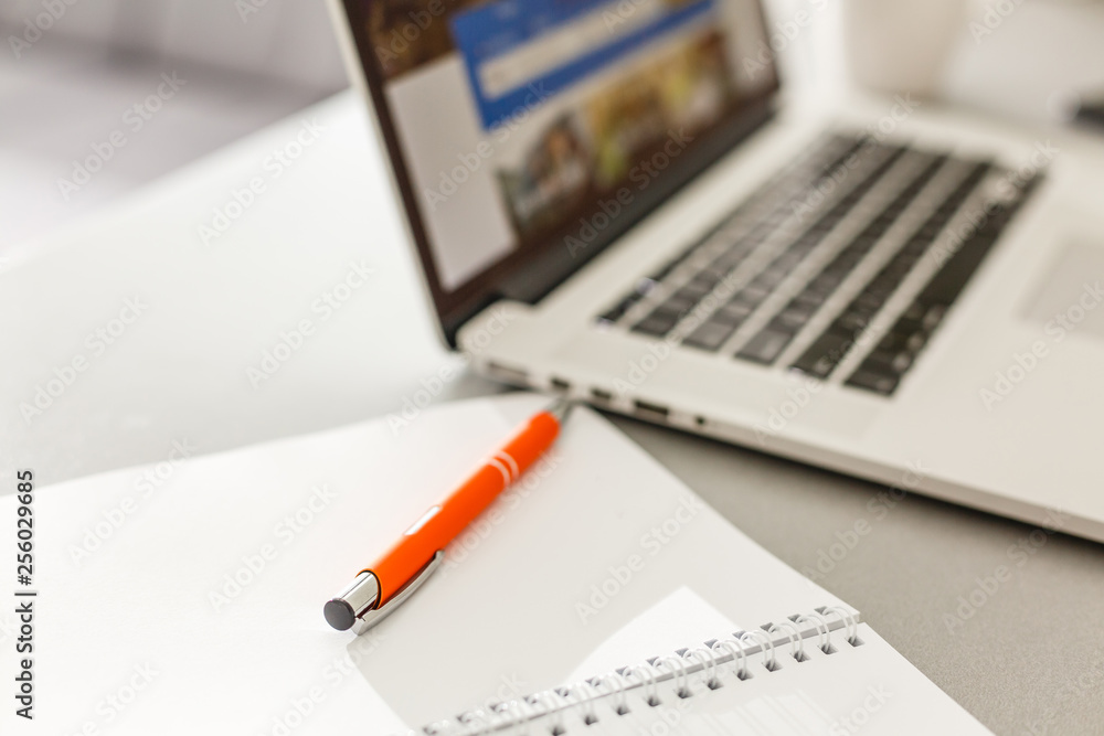 Cup of hot coffee on wooden desk with laptop and notebook. inspiration moment,workspace or coffee break in morning/ selective focus Cup of hot coffee on wooden desk with laptop and notebook. inspiration moment,workspace or coffee break in morning/ selective focus