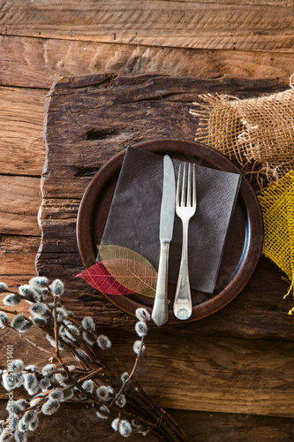 Spring table setting. Cutley on wood photo