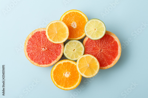 Colorful sliced fruits on blue background