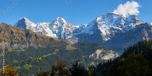 Panoramic mountain view of Jungfrau, Monch, Eiger at sunset in Switzerland.