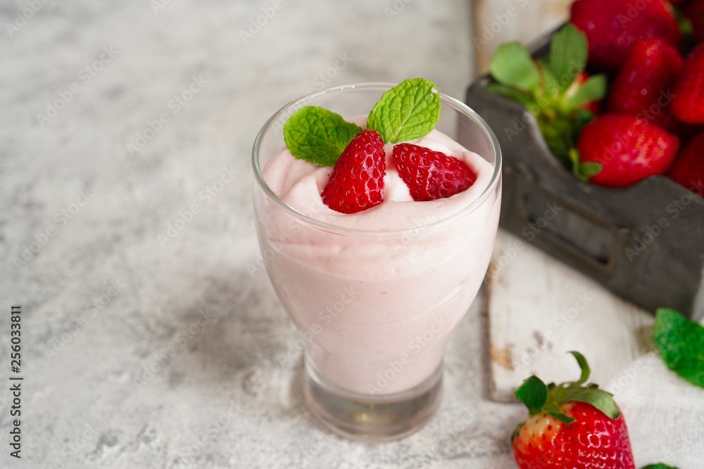 Homemade Strawberry Mousse topped with berries and mint leaf garnish, selective focus Homemade Strawberry Mousse topped with berries and mint leaf garnish, selective focus