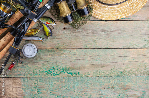 fishing tackle on a wooden table. 