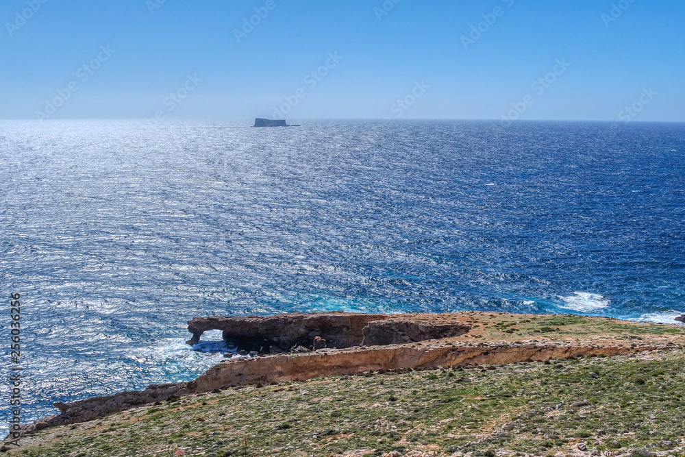 Arch Ras il-Hamrija (Ghar Hanex) and Filfla island near Hagar Qim and Mnajdra, Malta