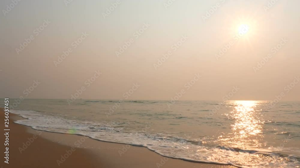 Sunset on an island beach during a hazy day Sunset on an island beach during a hazy day