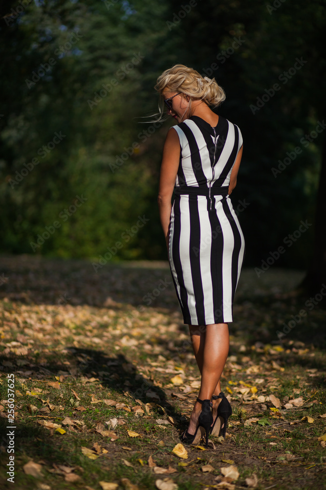 beautiful blonde woman in the autumn forest at sunset beautiful blonde woman in the autumn forest at sunset