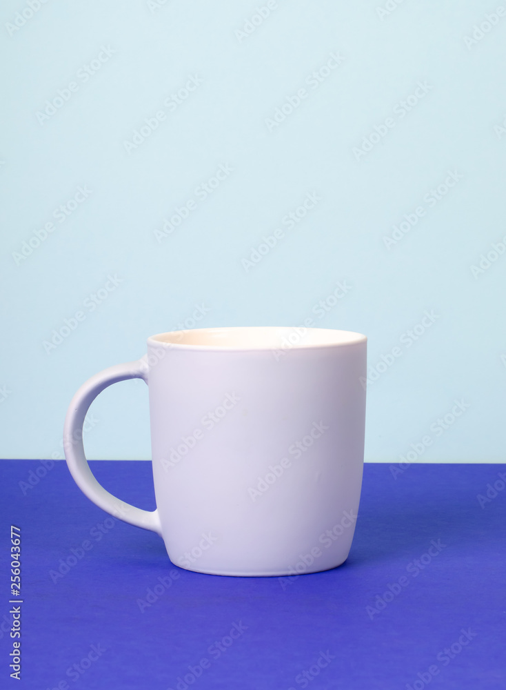 Obraz premium New grey Cup on solid pastel background.