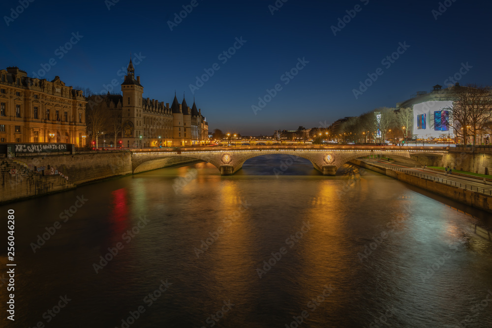 Paris, France - 03 10 2019: Palace of the City and Bridge to change by night