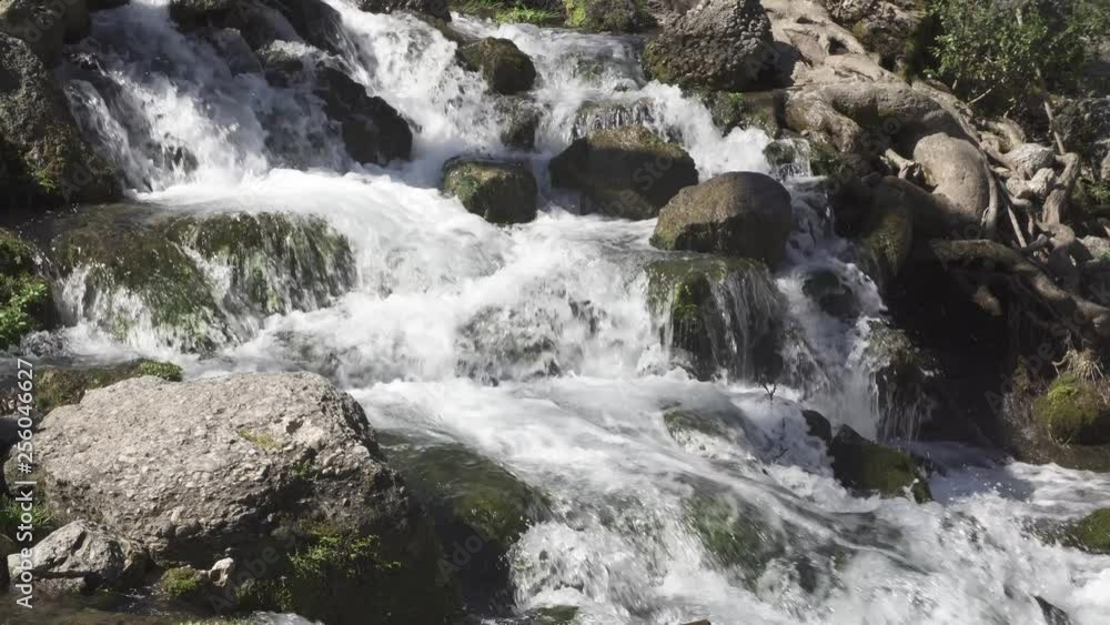 the raging flow of a mountain river like a waterfall the raging flow of a mountain river like a waterfall