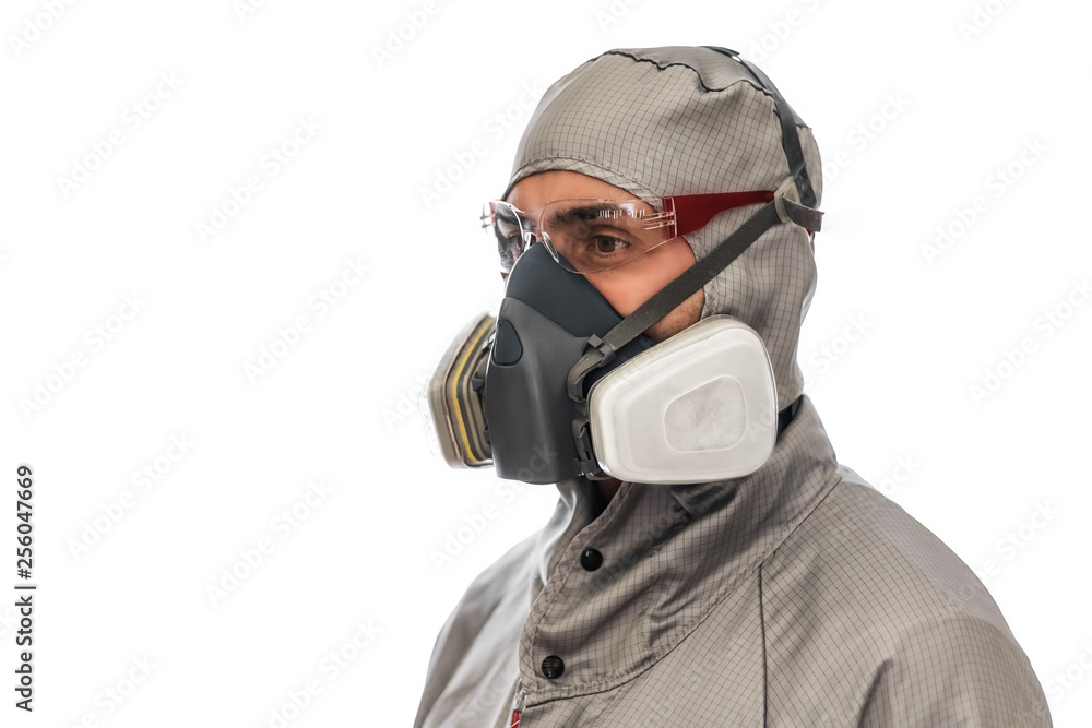 production worker in protective clothing, mask and glasses