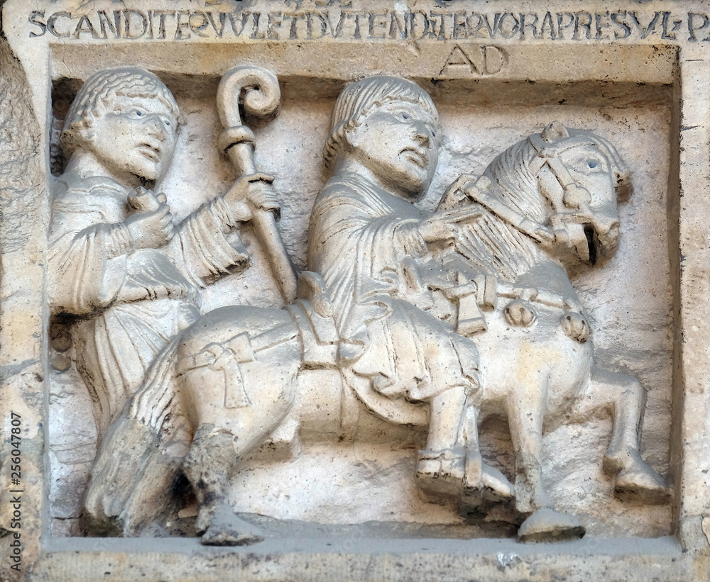 Scenes from the life of St. Geminianus : journey of San Geminianus  to the east to free the daughter of Byzantine emperor Jovian, from the devil, bass relief by Wiligelmo, Modena Cathedral, Italy 