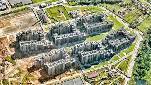 construction of modern residential building structure on summer day city urban architecture background aerial satellite view new house on street exterior cityscape landmark town skyline landscape
