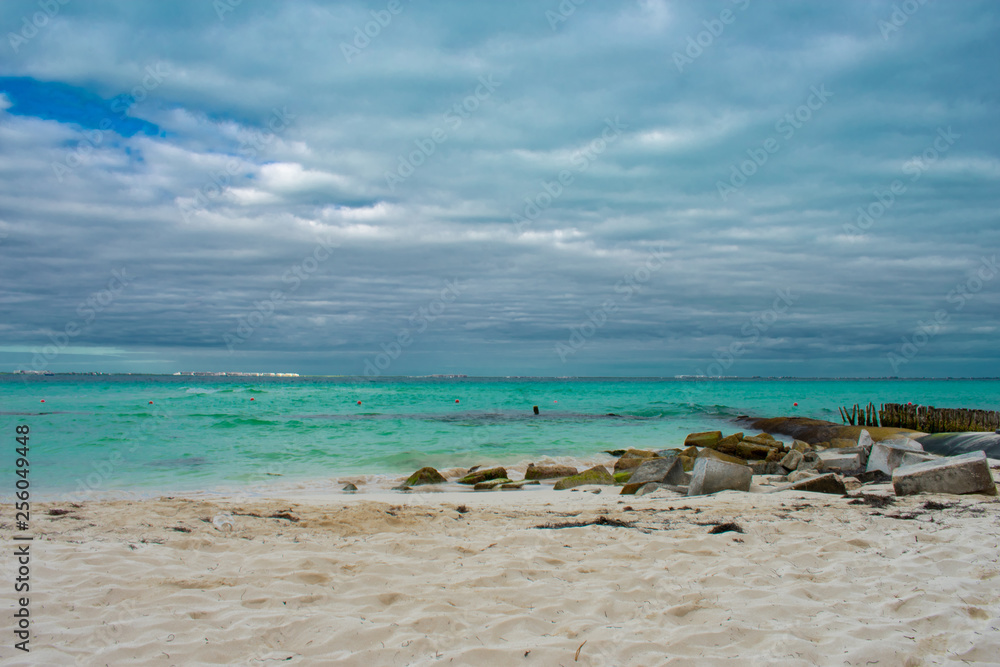 Beautiful view of Caribbean sea and beach in Tulum, Mexico. Crystal clear blue water. 