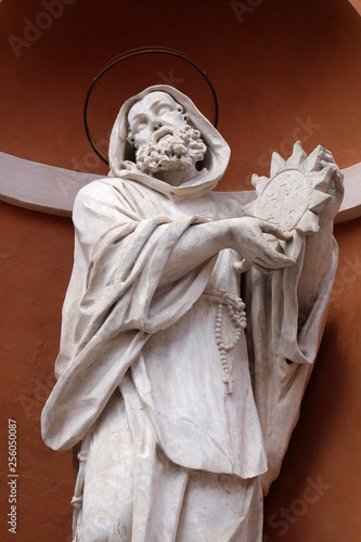 Saint Francis statue on the portal of St. Barbabas Church, Italy