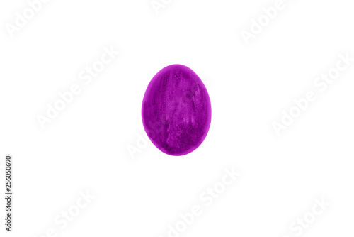 Egg purple color against white background. Painted egg. Traditional symbol and decoration of the holiday. Empty surface