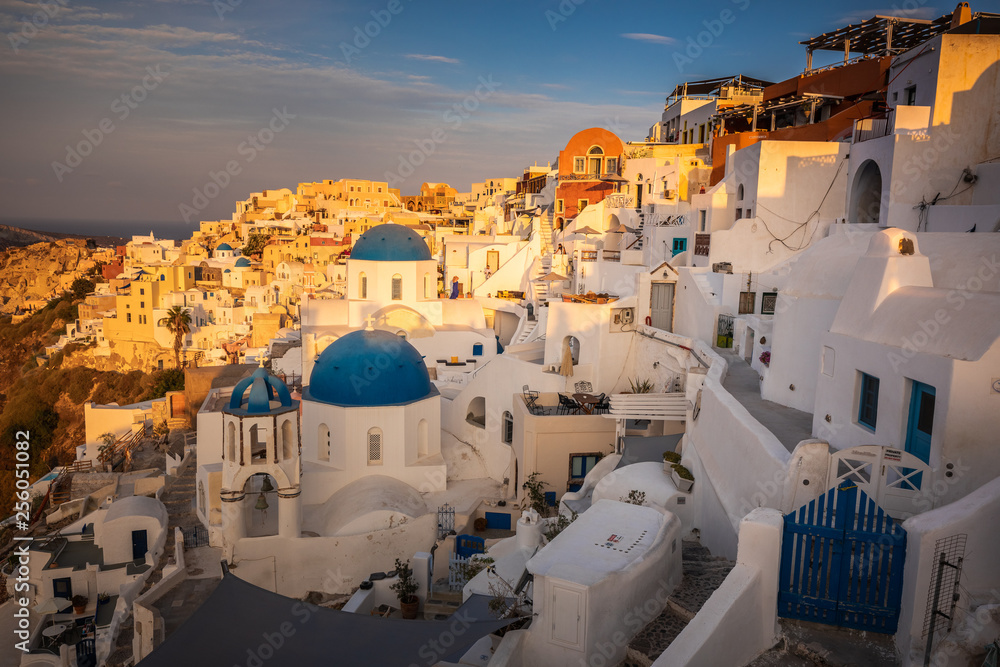 Fototapeta premium Santorini greece famous Oia in sunset time golden hour 