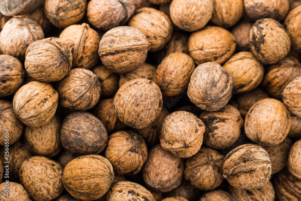 Natural walnut pattern texture, Raw bio walnuts background Natural walnut pattern texture, Raw bio walnuts background