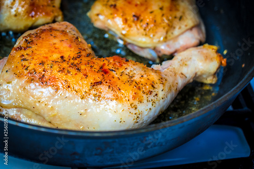 Fotografie Fry the chicken leg in a pan.