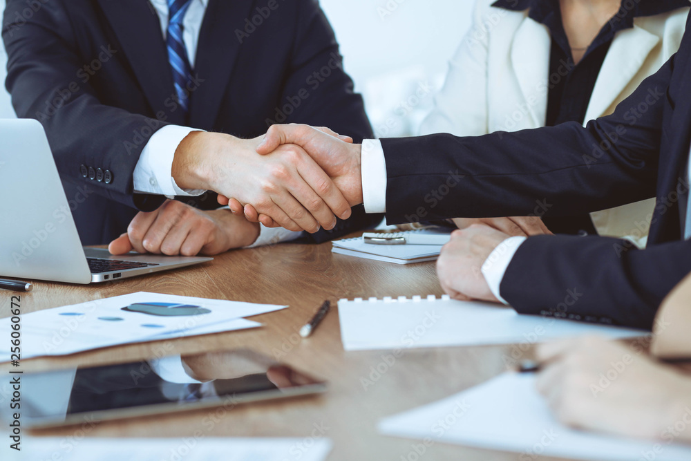 Obraz premium Business people shaking hands at meeting or negotiation in the office. Handshake concept. Partners are satisfied because signing contract