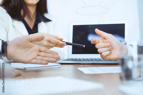 Business woman giving pen to businessman ready to sign contract. Success communication at meeting or negotiation