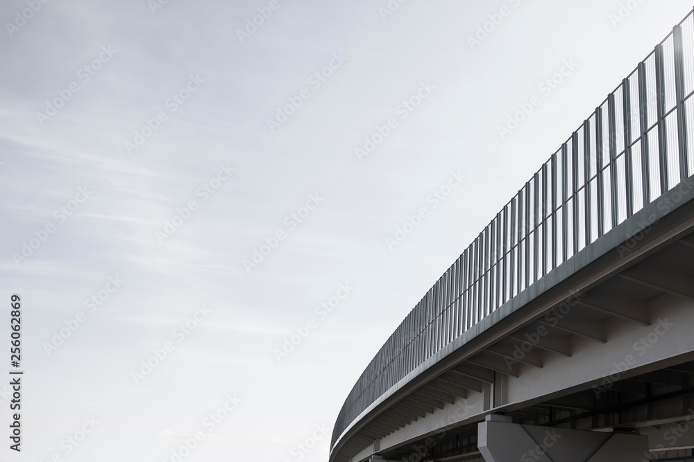 Fototapeta premium Glass wall as sound protection on highway and clear sky