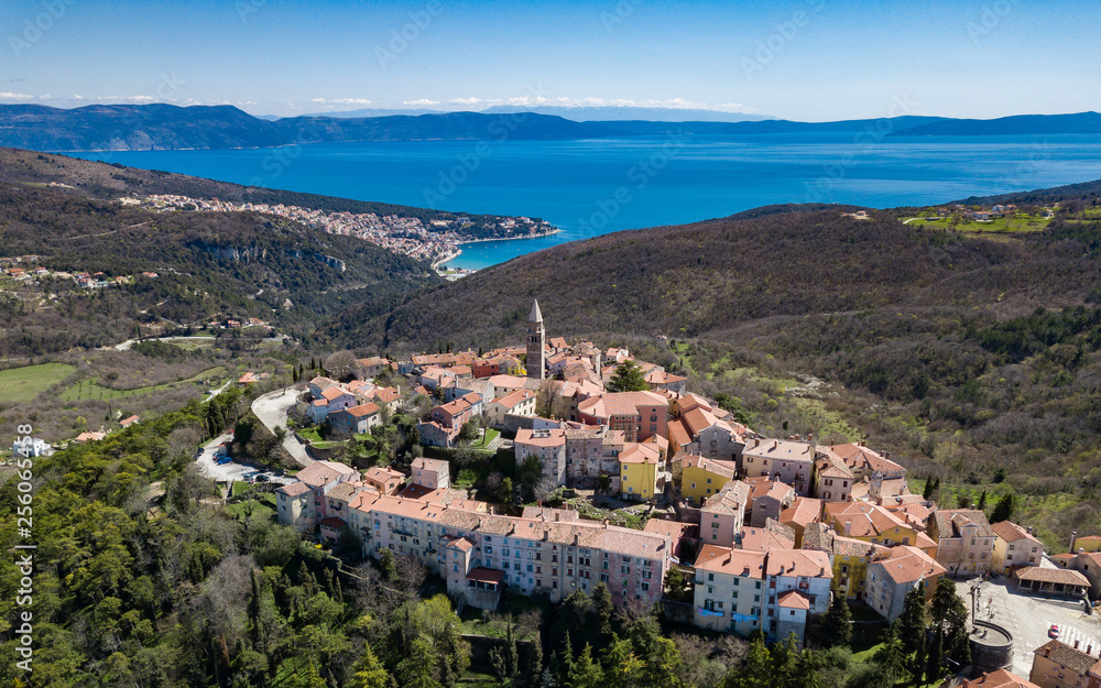 Aerial shot of the Croatian town Labin with a beautiful  background featuring the port of Rabac