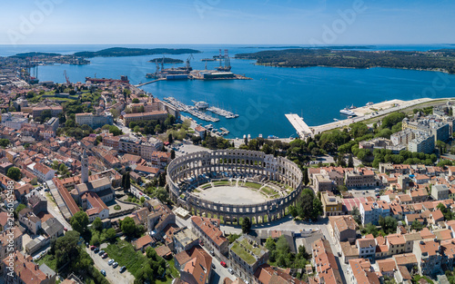 Pula aerial drone shot. The Arena is the only remaining Roman amphitheatre to have four side towers and with all three Roman architectural orders entirely preserved. It was constructed in 27 BC–68 AD