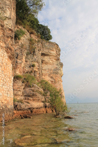 Rocky shore on lake Garda Sirmione Italy