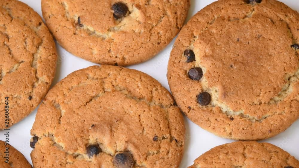 Oat cookies with chocolate pieces rotating close-up Oat cookies with chocolate pieces rotating close-up