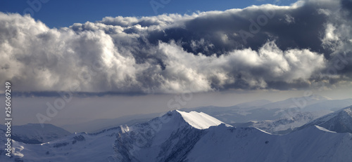 Winter mountains in evening and cloudy sky © BSANI