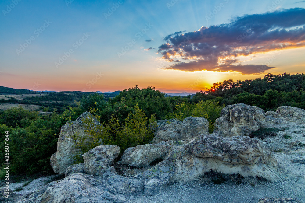 Obraz premium The sun setting over the Stone Mushrooms near Beli Plast village, Kardzhali Municipality, Bulgaria