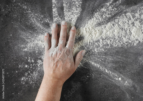 bakers hand with flour