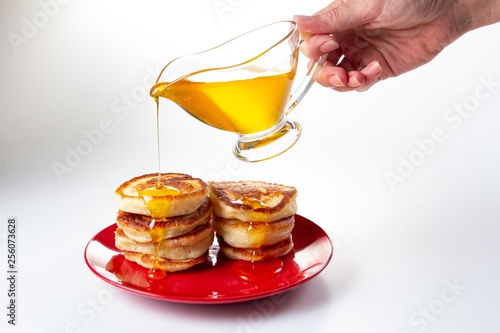 Honey syrup on pancake, del...