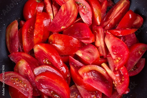 tomato frying on pan, cooki...