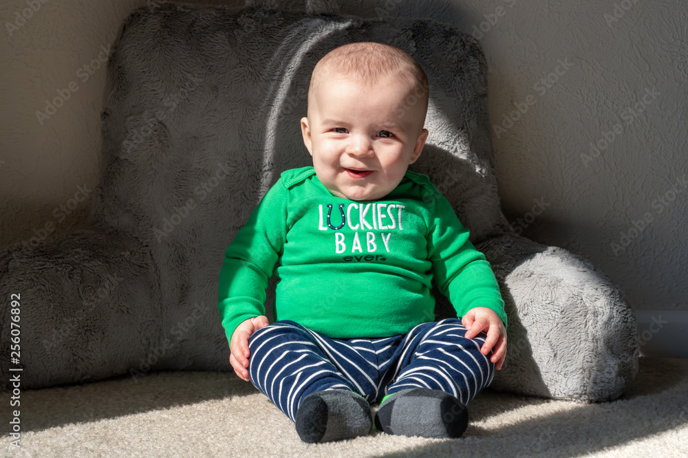 Naklejka premium Cute baby boy in St. Patrick's day outfit
