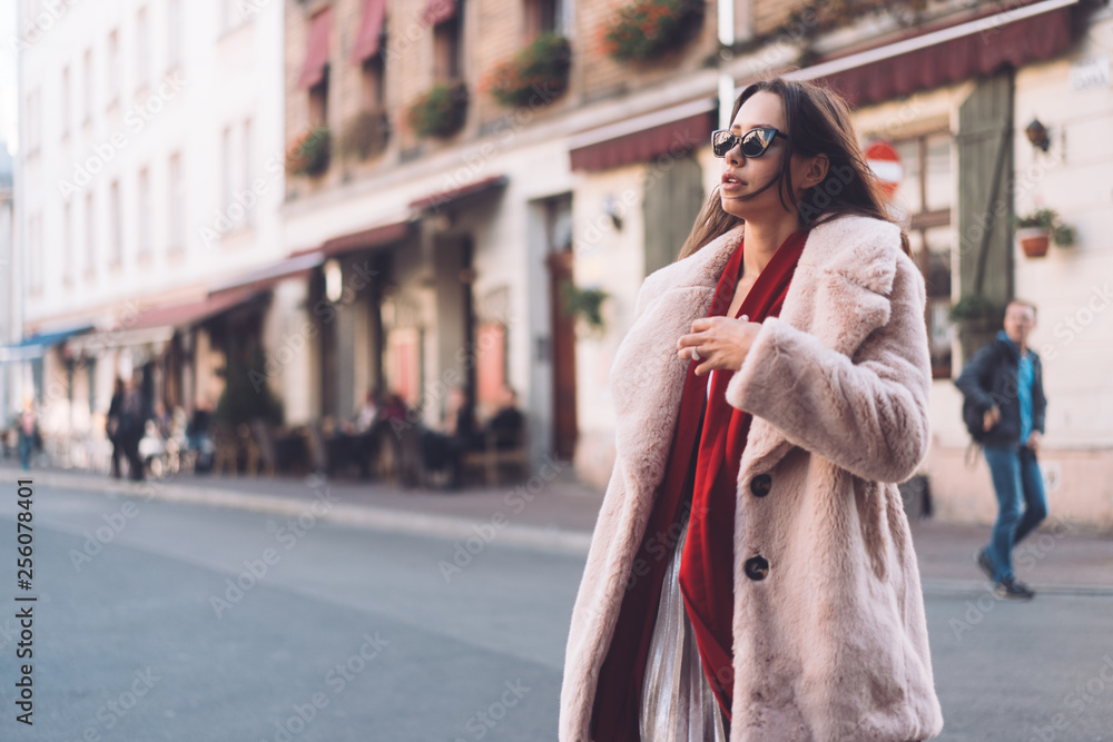 Obraz premium young beautiful stylish woman walking in pink coat