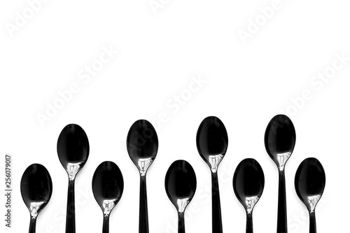Plastic spoons for eco and Earth protection concept on white background top view mockup © 9dreamstudio