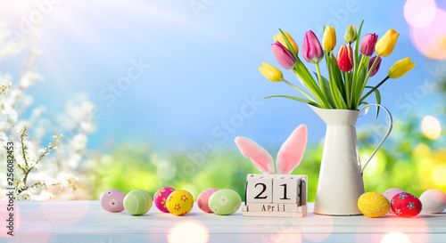 Easter - Calendar Date With Decorated Eggs And Tulips In Sunny Garden