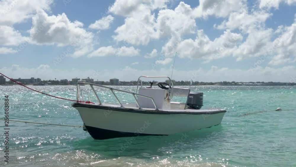 Boat gently rocking back and forth in the crystal clear waters of the Bahamas Boat gently rocking back and forth in the crystal clear waters of the Bahamas