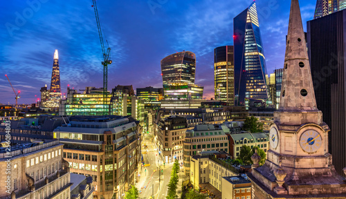 Aerial view of skyscrapers of the world famous bank district of central London after dusk, street view