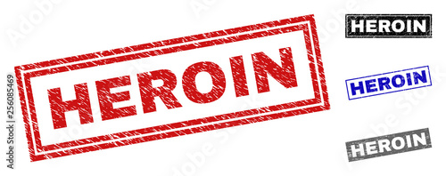 Grunge HEROIN rectangle stamp seals isolated on a white background. Rectangular seals with grunge texture in red, blue, black and grey colors.