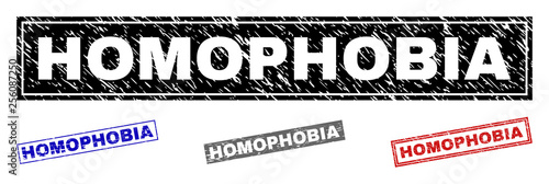 Grunge HOMOPHOBIA rectangle stamp seals isolated on a white background. Rectangular seals with grunge texture in red, blue, black and gray colors.