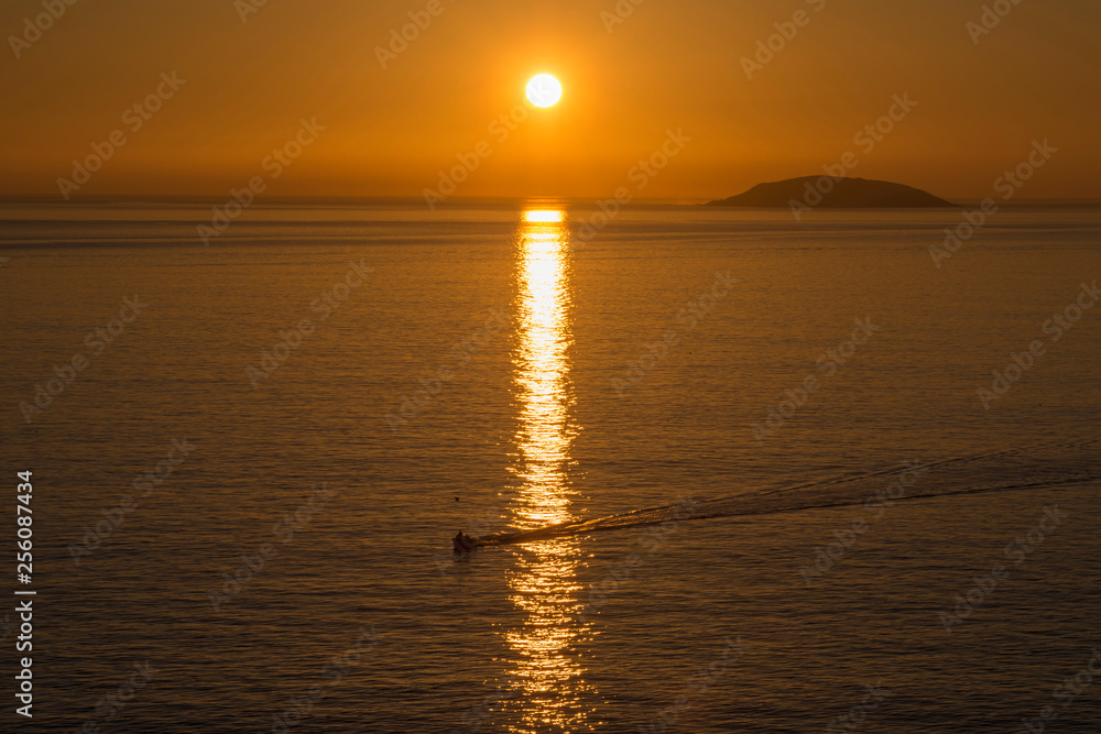 Fototapeta premium fishing boat returning from work