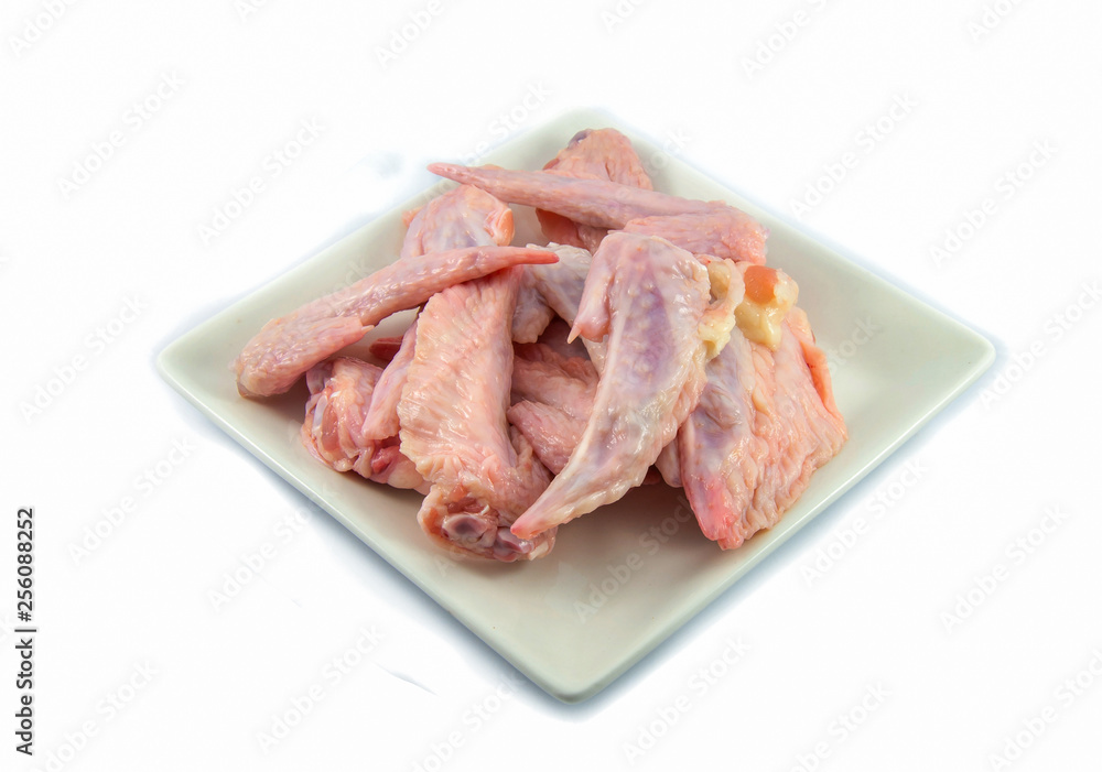Fresh raw chicken wings on plate isolated on white background