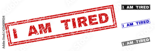 Grunge I AM TIRED rectangle stamp seals isolated on a white background. Rectangular seals with grunge texture in red, blue, black and grey colors.