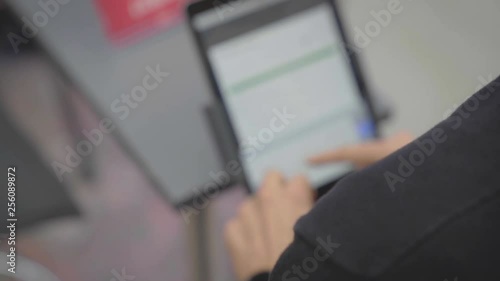 Man Filling out Form on iPad
